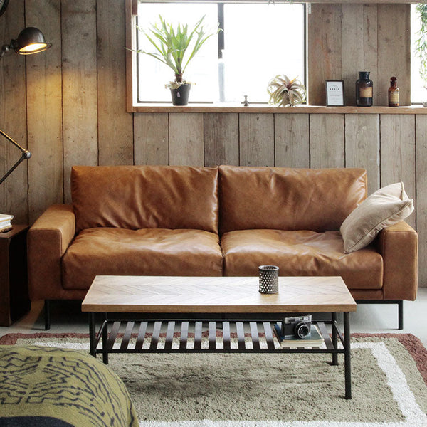 ヴィンテージソファのルーズな張り感をイメージした座面。 #オーカーブラウン（スーパーレザーテックス）